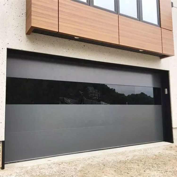 Black modern garage door with smooth flush sectional panels frameless design