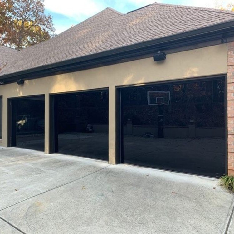 Automatic frameless black glass panel sectional garage door