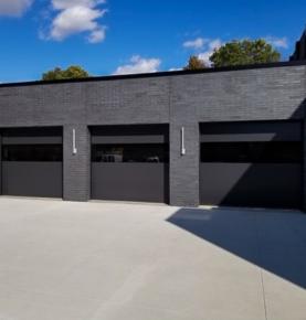 Ultra-Sleek Infinity Flush Panel Smooth Aluminum Sterling Garage Door with Horizontal Modern Tinted Glass Design